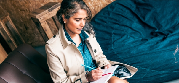 Arden University student studying in breakout area